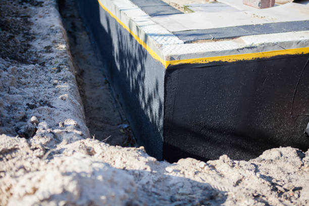 Professional Waterproofing technician working in Bedford, OH